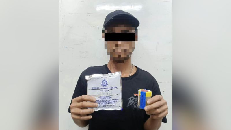 A man positive for amphetamine, methamphetamine is being held at the mouth.